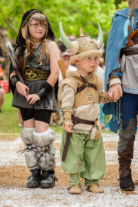 Children dressed in Renaissance costumes at Scarborough Renaissance Festival 2026 in Waxahachie Texas
